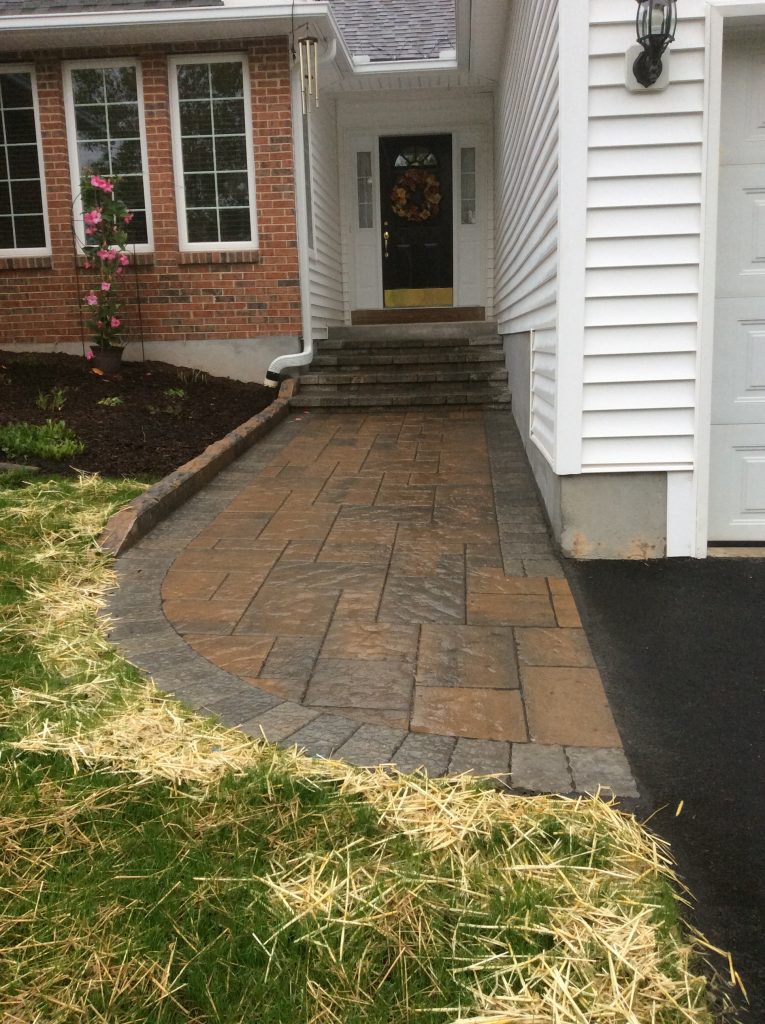 Pavers installed on a front walkway.