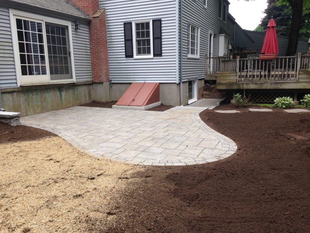 Patio pavers leading up to a deck.